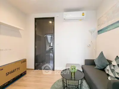 Modern living room with sleek furniture and smart TV setup, perfect for contemporary living.