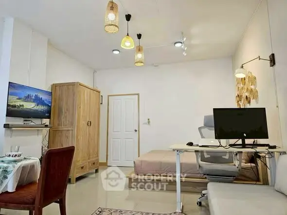 Modern studio apartment with cozy workspace and stylish decor