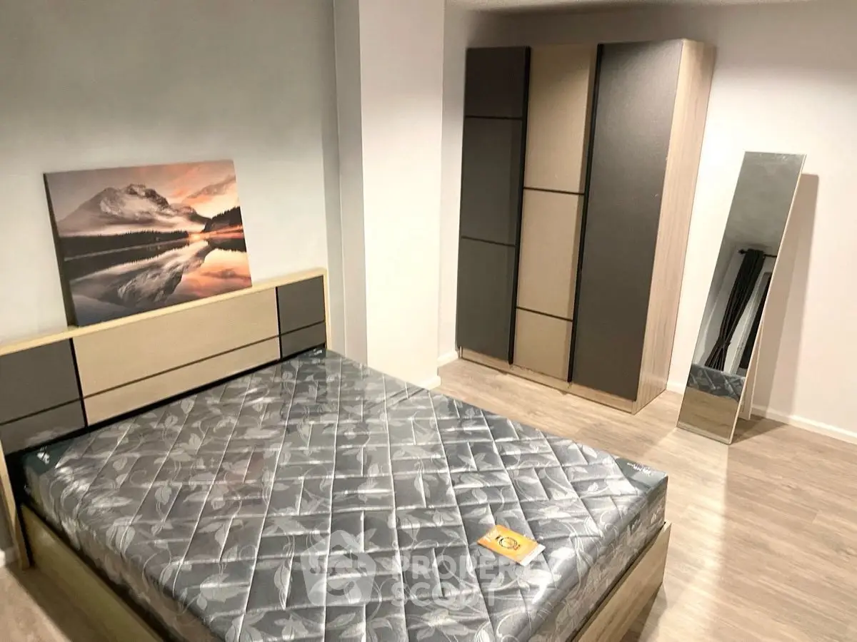 Modern bedroom with stylish wardrobe and elegant decor