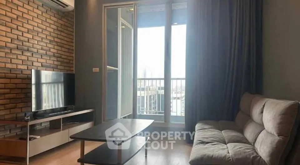 Modern living room with exposed brick wall and balcony view