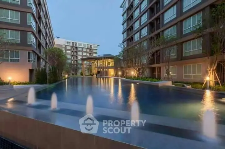 Luxurious apartment complex with serene pool and modern architecture