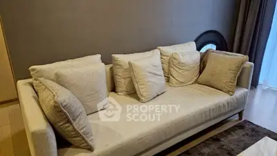 Stylish modern living room with elegant beige sofa and cozy cushions