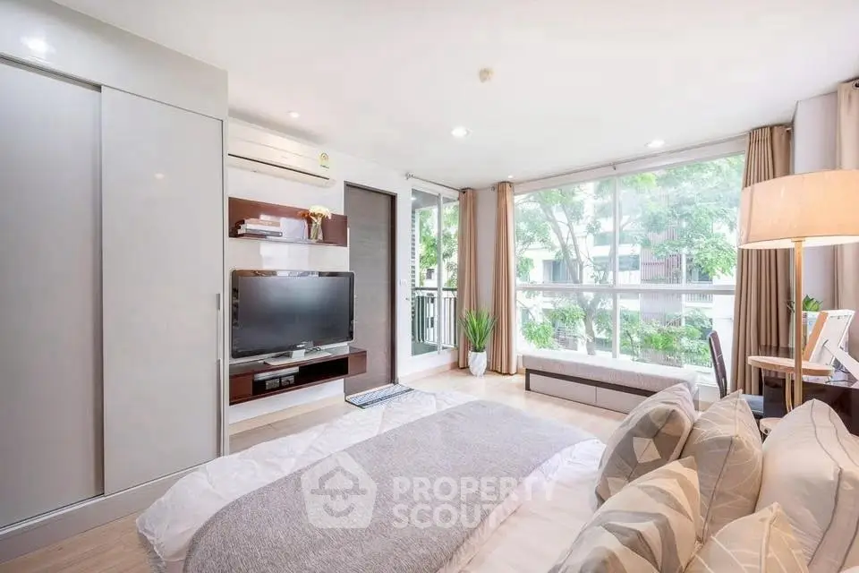 Bright and modern bedroom with large windows and stylish decor