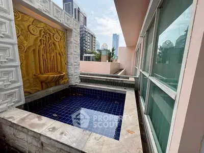Luxurious private balcony with a stylish plunge pool and city views, perfect for relaxation and entertainment.