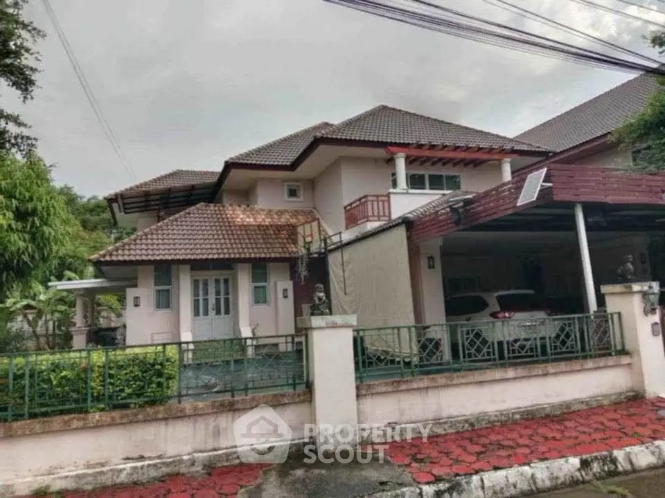 Charming suburban house with tiled roof and spacious driveway