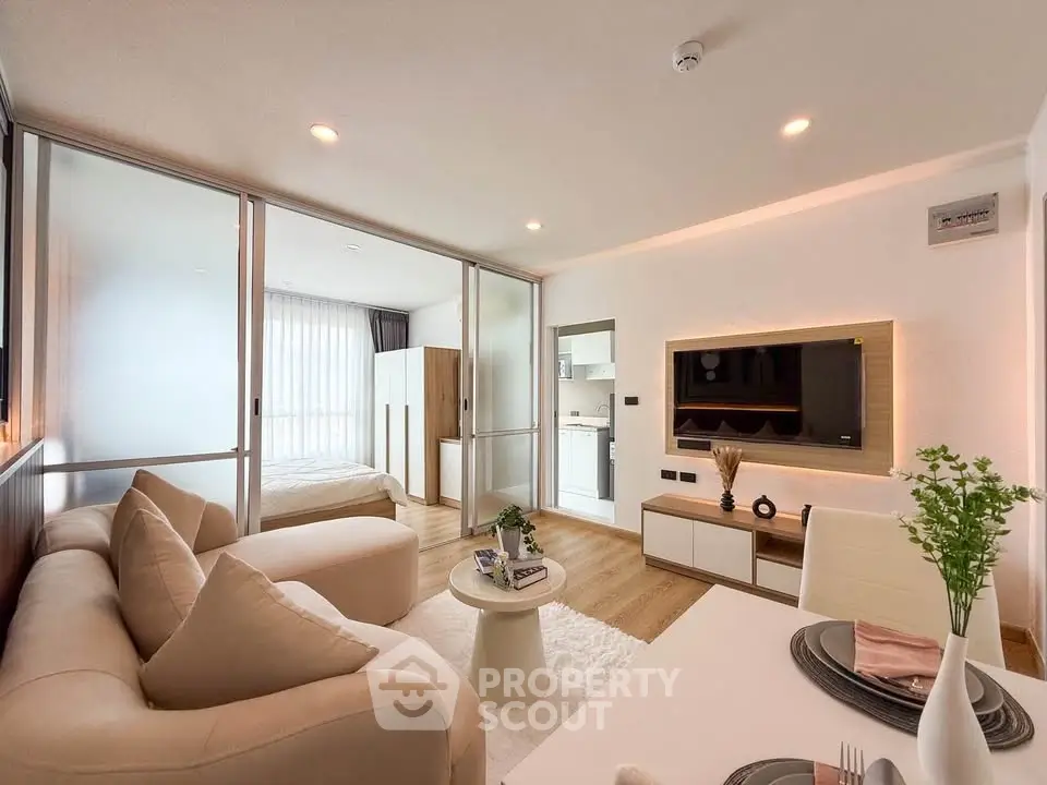 Modern open-plan living room with cozy sofa and stylish decor