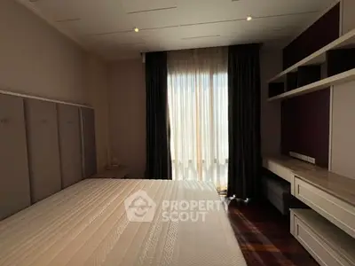 Spacious bedroom with elegant design and natural light