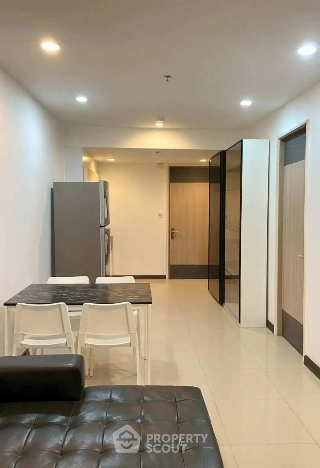 Modern apartment interior with sleek dining area and stylish furniture