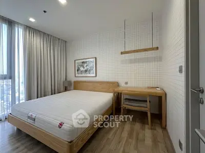 Modern minimalist bedroom with wooden furniture and large window view.