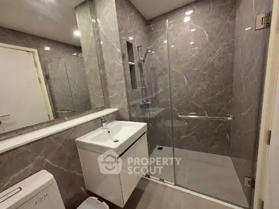 Modern bathroom with sleek design and glass shower enclosure