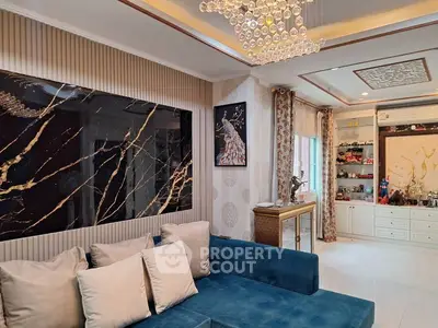 Luxurious living room with elegant decor and modern chandelier