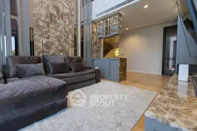 Luxurious living room with plush sofa and elegant marble accents