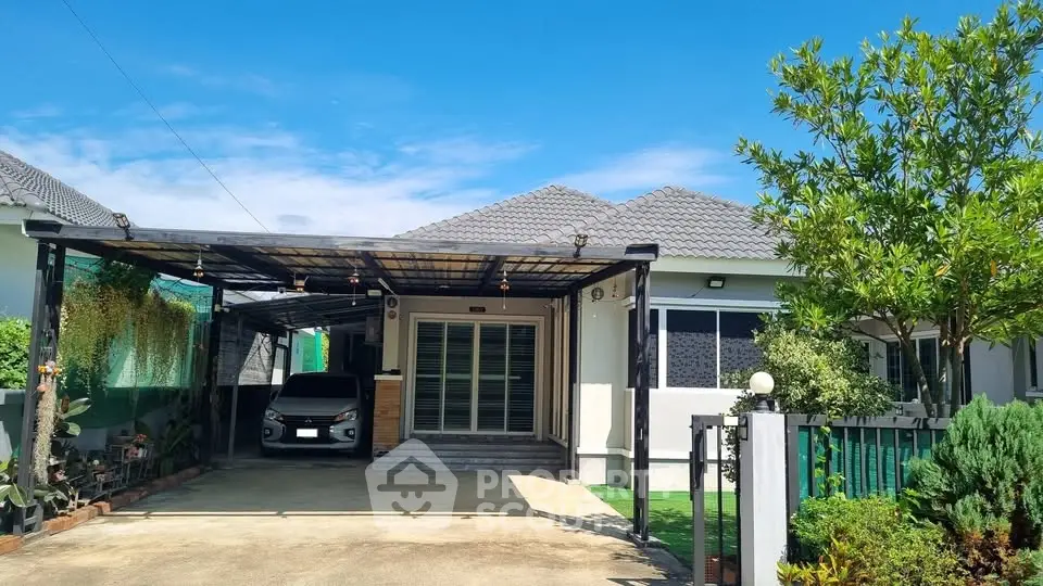 Charming single-story home with carport and lush garden, perfect for family living.