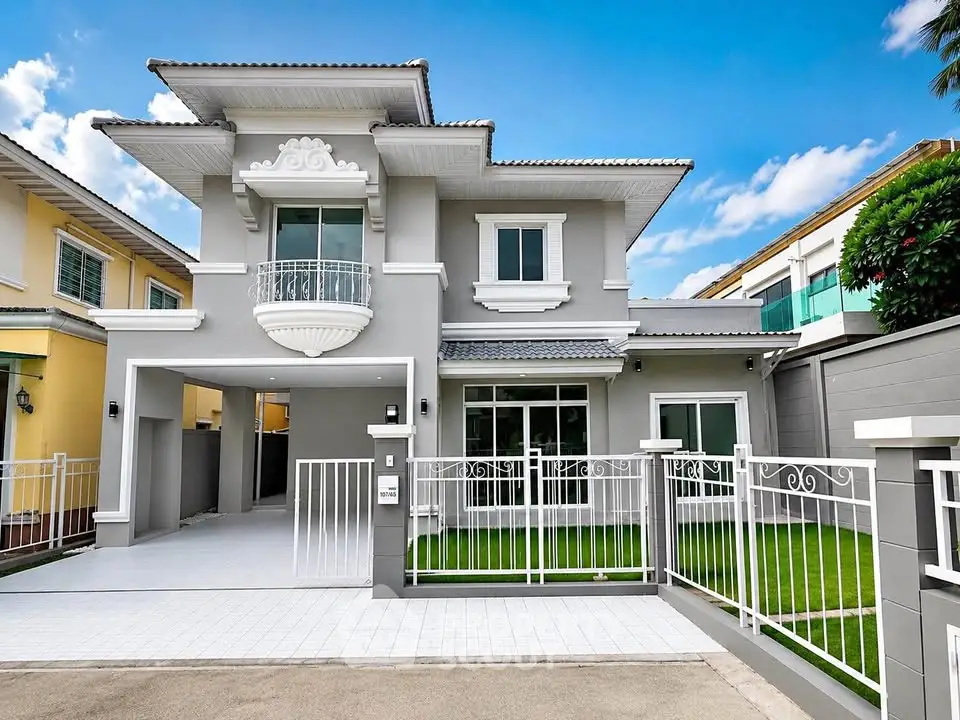 Stunning modern two-story house with elegant facade and spacious driveway in a serene neighborhood.