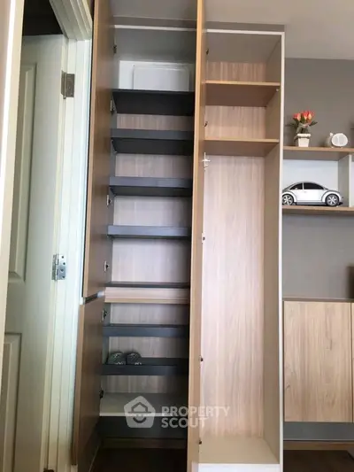 Modern wooden storage cabinet with open shelves in a stylish interior setting.