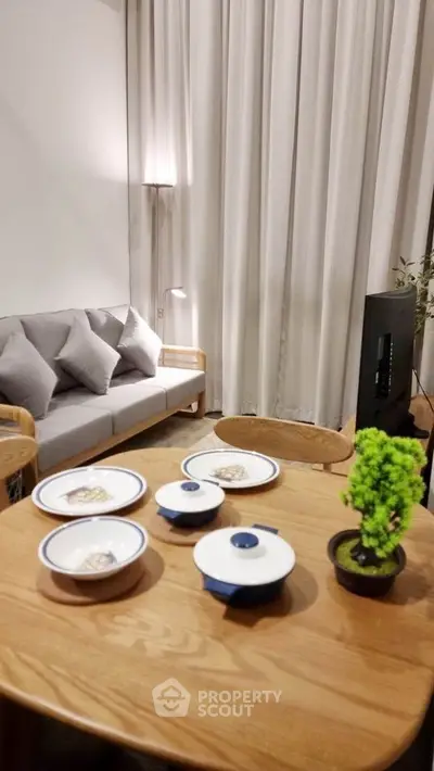 Modern living room with cozy sofa and elegant dining setup