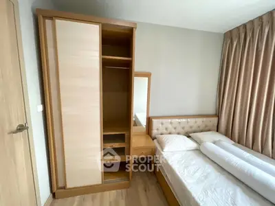 Cozy bedroom with wooden wardrobe and plush bed in modern apartment