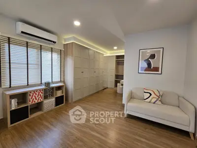 Spacious modern living room with wooden flooring and stylish decor