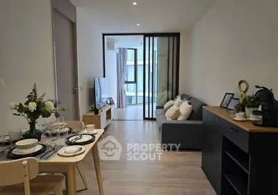 Modern living room with elegant dining area and cozy seating, perfect for urban living.