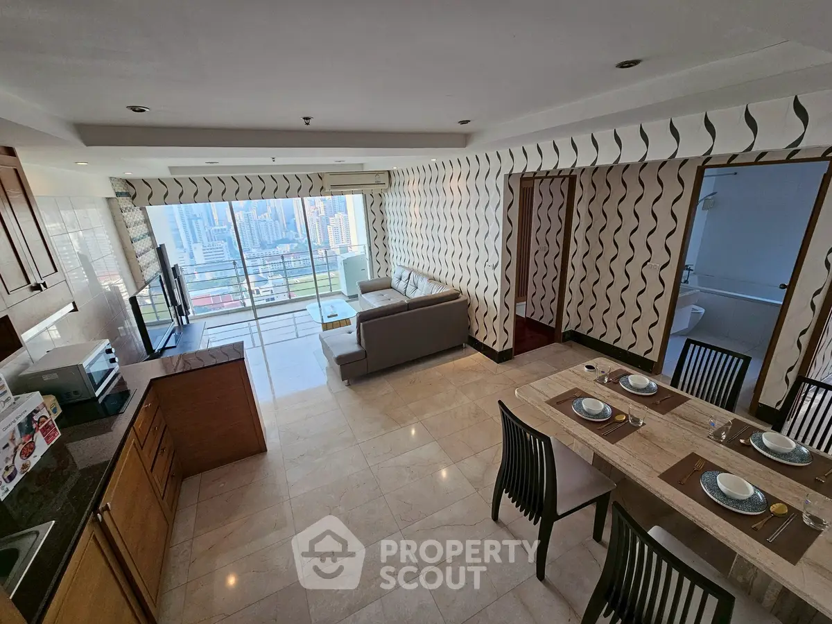 Spacious open-plan living room with city view and modern kitchen