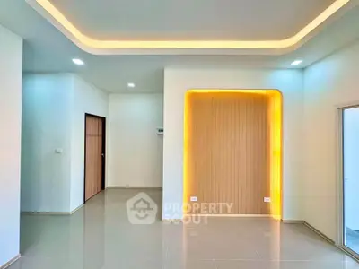 Modern minimalist interior with ambient lighting and sleek tile flooring