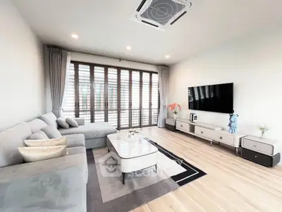 Spacious modern living room with elegant decor and natural light