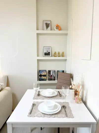 Chic dining area with elegant table setting and modern decor in cozy apartment