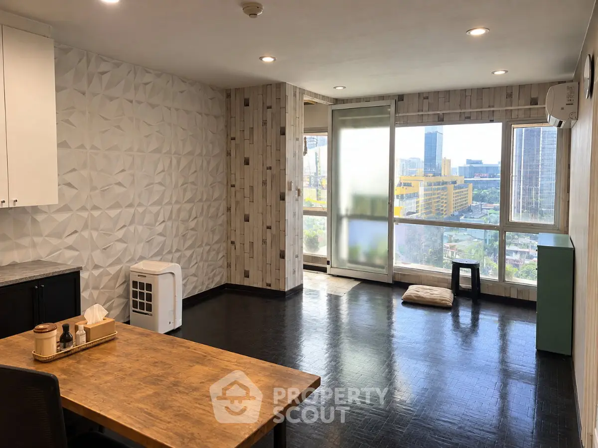 Spacious modern living room with city view and stylish decor
