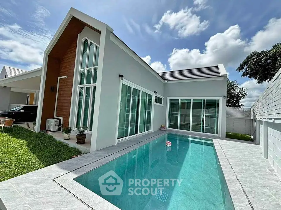 Modern single-story house with private pool and large windows
