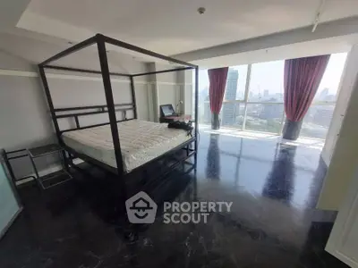 Luxurious bedroom with stunning city view and elegant four-poster bed in high-rise apartment.