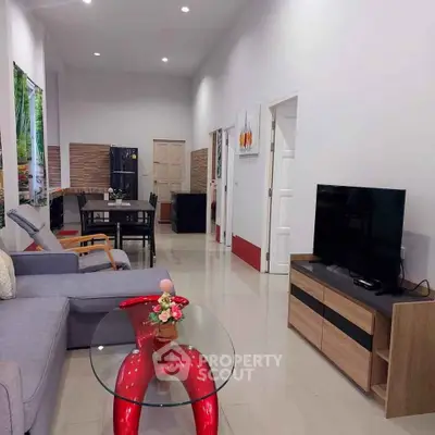 Spacious modern living room with stylish furniture and open layout, perfect for relaxation and entertainment.