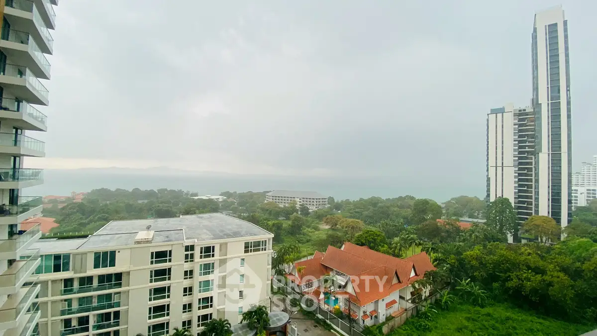 Stunning high-rise view with lush greenery and modern architecture.