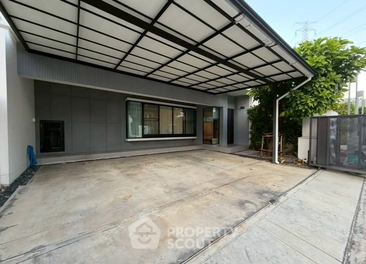 Modern covered parking area with sleek design and spacious layout.