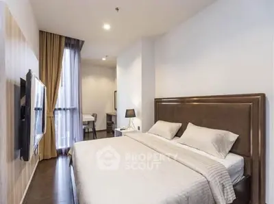 Modern bedroom with elegant decor and natural light