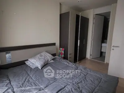 Cozy bedroom with modern furniture and neutral decor, perfect for relaxation.