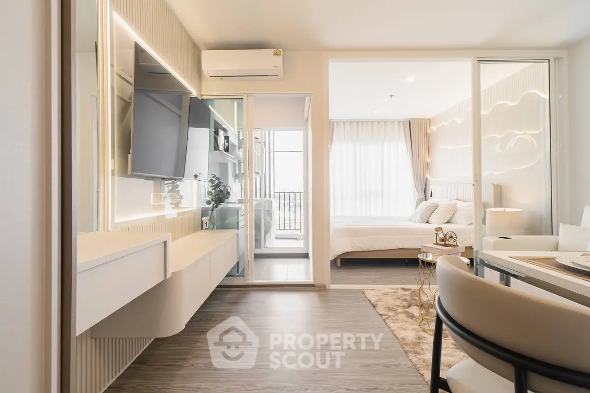 Modern open-plan living room with sleek design and natural light