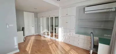 Spacious bedroom with built-in wardrobes and study area, featuring modern design and ample natural light.