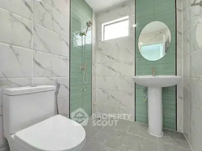 Modern bathroom with elegant marble tiles and sleek fixtures
