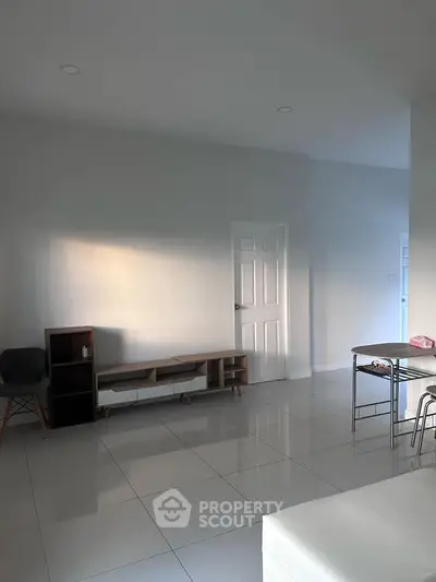 Spacious minimalist living room with modern furniture and natural light