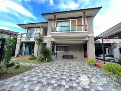 Modern two-story house with spacious driveway and lush garden