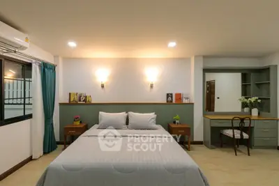 Spacious bedroom with elegant decor and cozy lighting