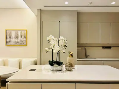 Modern kitchen with sleek cabinetry and elegant decor in a luxury apartment.