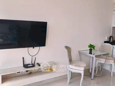 Modern living room with wall-mounted TV and elegant dining area
