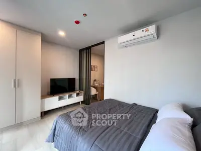 Modern bedroom with air conditioning and sleek furniture design