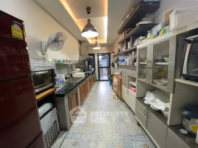 Spacious kitchen with modern appliances and ample storage in a cozy home.