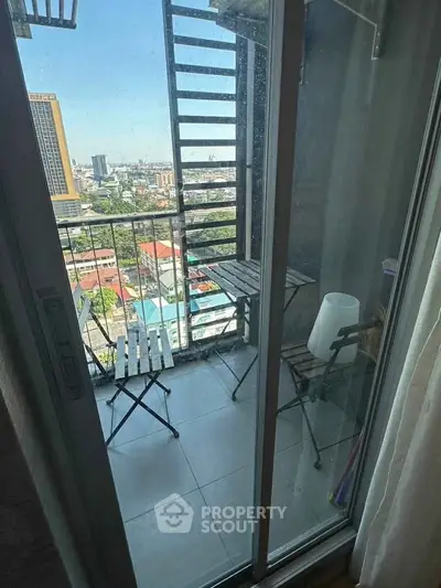 Charming balcony with city view, perfect for relaxation and enjoying the skyline.