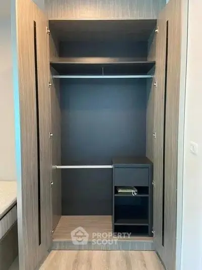 Spacious modern wardrobe with sleek design and ample storage space in a stylish bedroom.