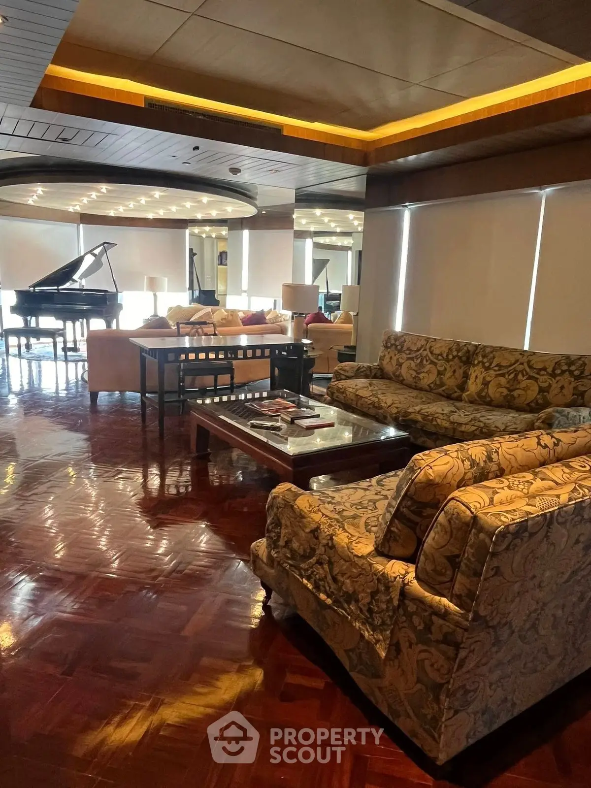 Luxurious living room with elegant furniture and grand piano, perfect for entertaining.