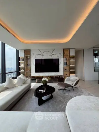 Luxurious modern living room with panoramic city views and elegant decor.
