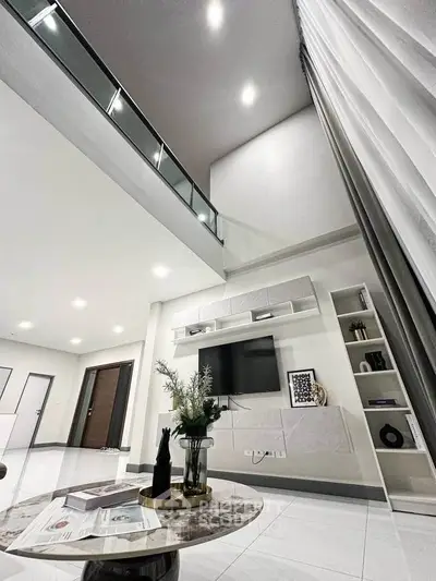 Modern living room with high ceiling and stylish decor